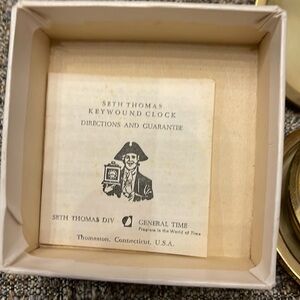 Seth Thomas key wound travel clock, yellow, dial luminous